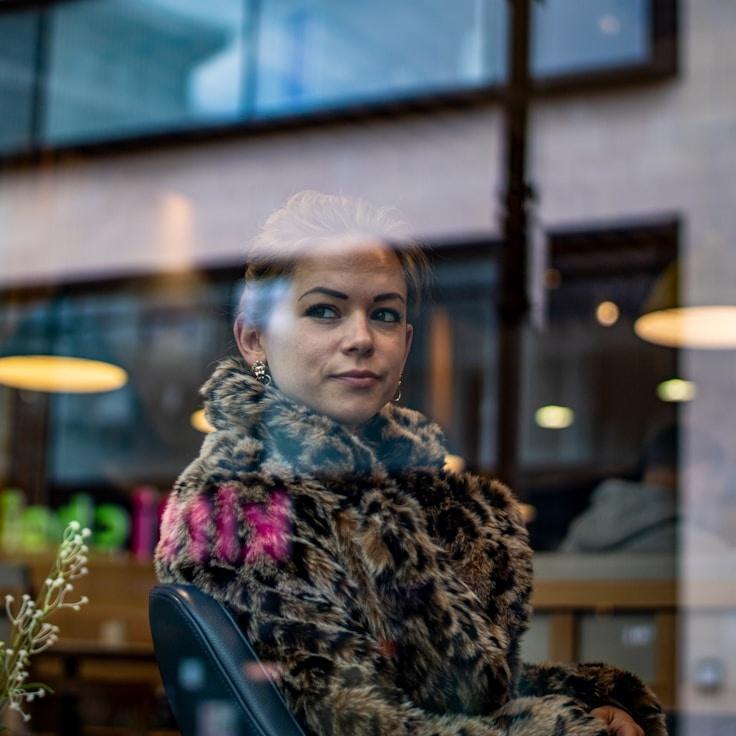 Riley Chen, Client Relations Director, discussing corporate gifting strategy with business clients